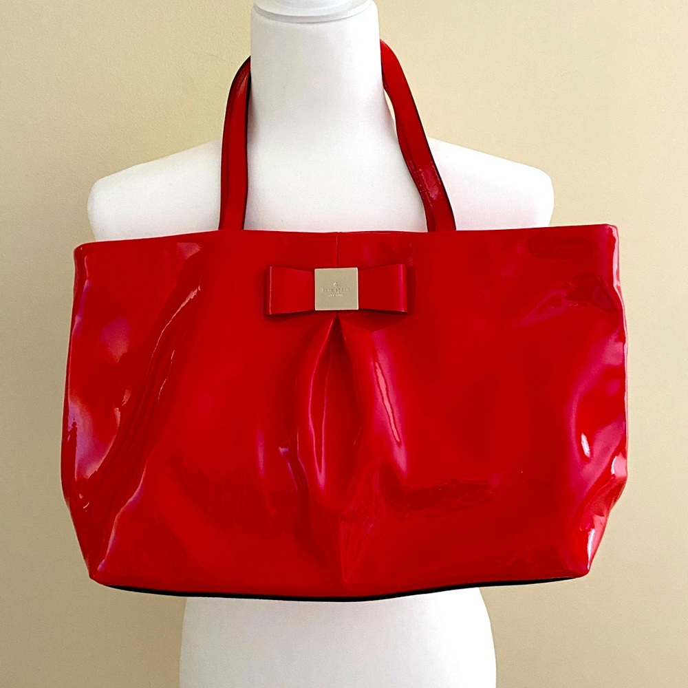 patent red Kate Spade handbag.
